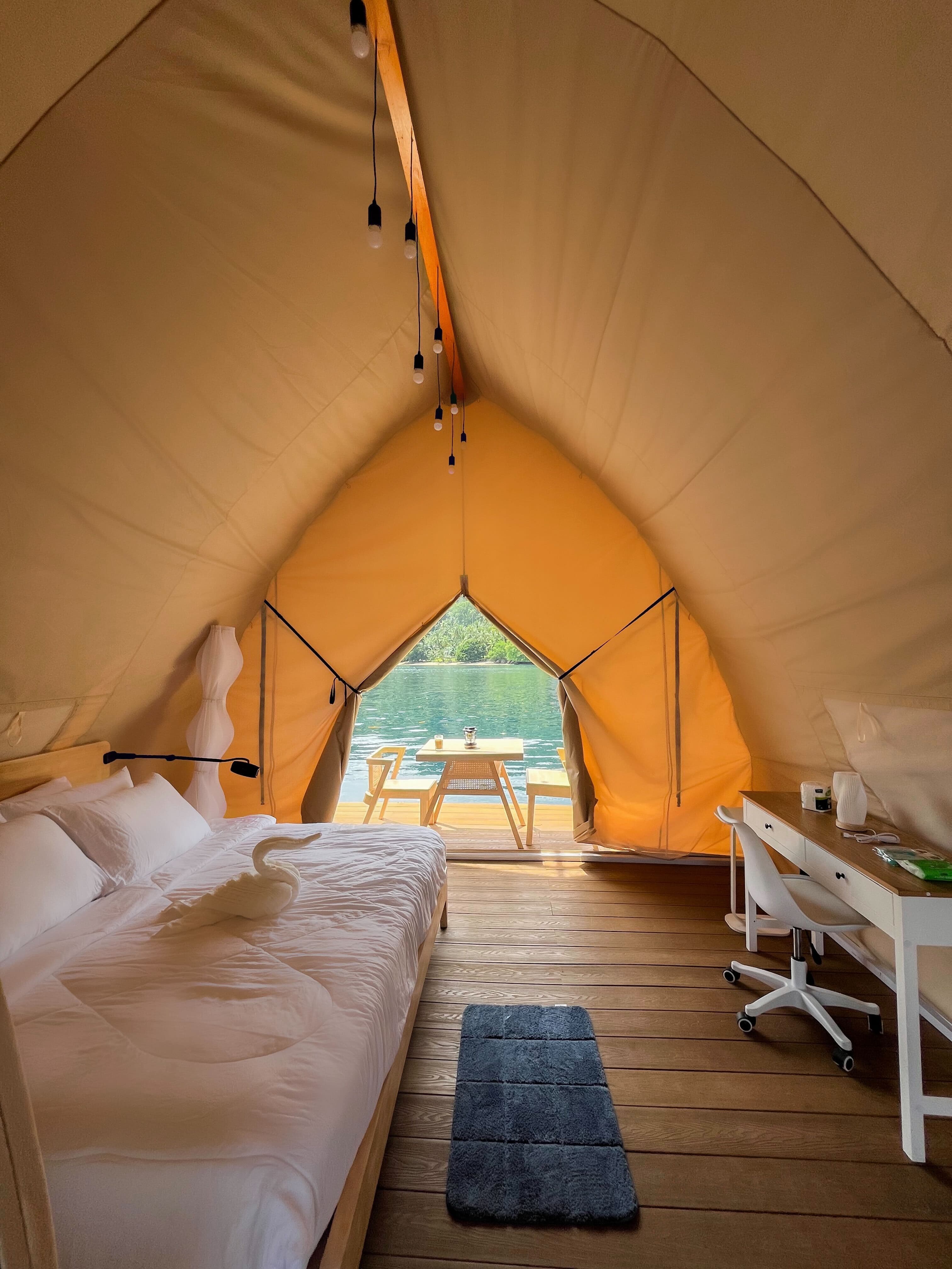 Glamping tent interior with ocean view