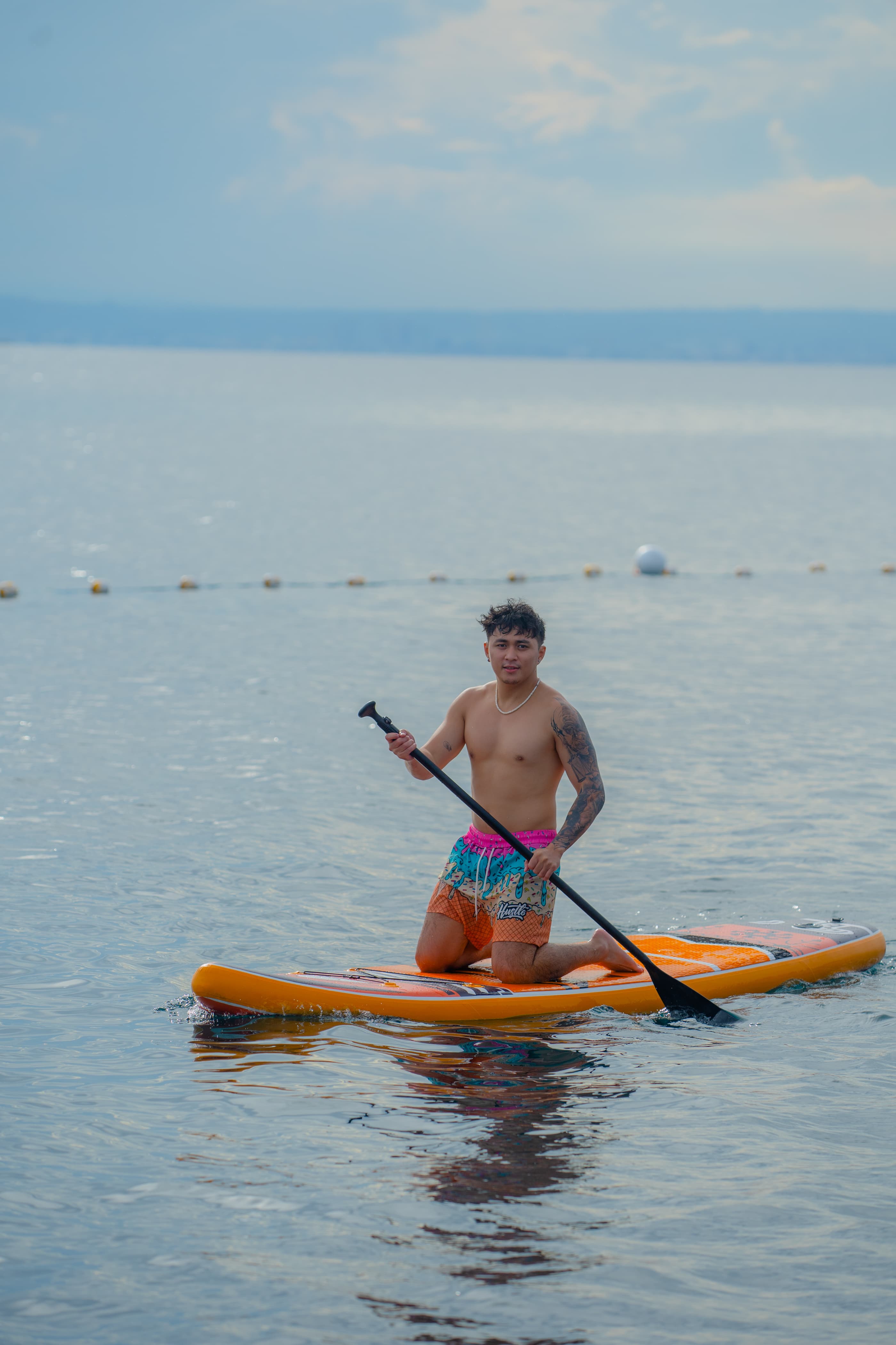 Paddleboarding on calm ocean